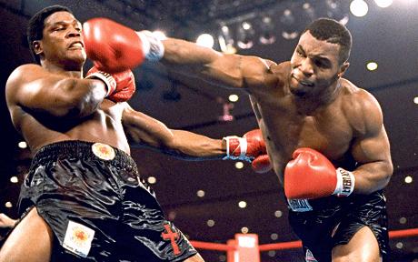 mike tyson in action. Mike Tyson is at the top of