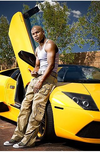 Floyd mayweather with his yellow Lamborghini