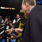 Floyd shows Jim Gray his hand