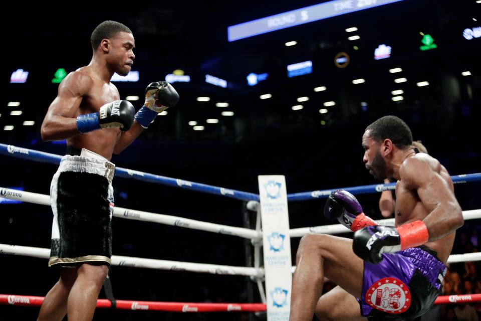 Errol Spence Jr. knocks down Peterson in Round 5. Photo Credit: Associated Press, AP.