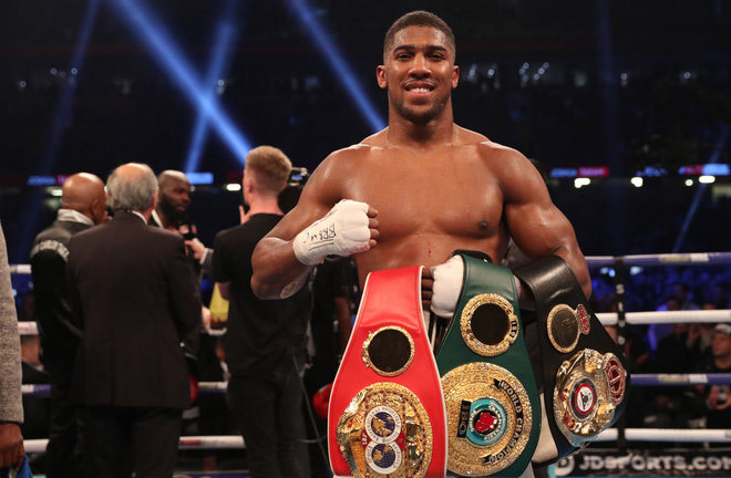 Anthony Joshua - holding his World Titles