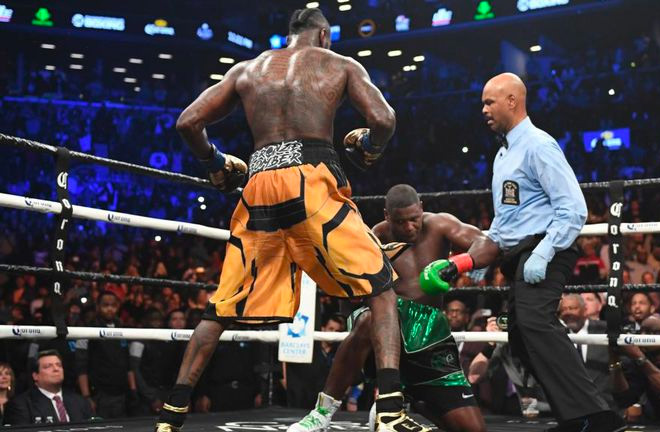 Round 10: Wilder put Ortiz to the floor three times resulting in the referee calling the fight to an end.