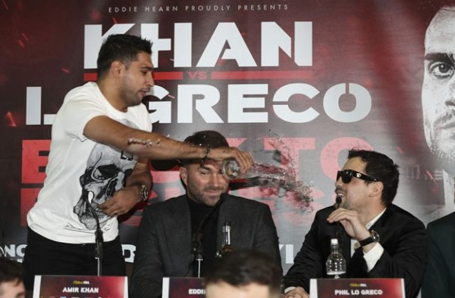 Khan throws a glass of water on Lo Greco during the Press Conference. Photo Credit: The Ring Magazine 