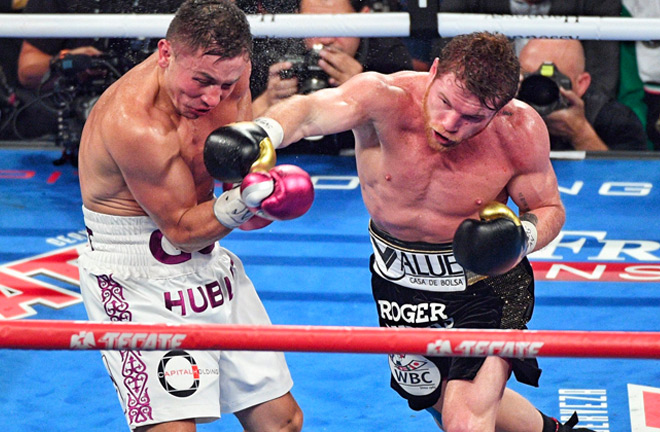 Both fighters traded some heavy hits with each other during a great night of boxing. Photo Credit: Twitter - @PowersImagery.