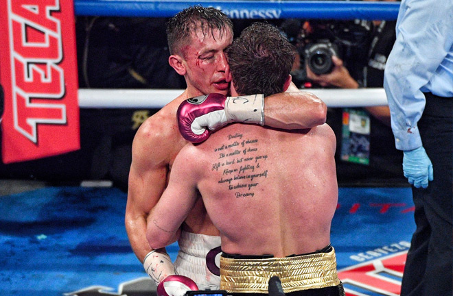 Despite the bad blood between both fighters - they managed to embrace at the end of the fight. Photo Credit: Twitter - @PowersImagery.