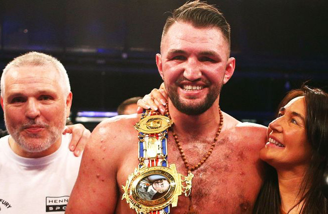 Hughie Fury flanked by his parents. Photo credit: skysports.com