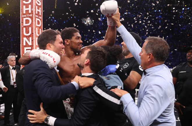 Joshua was joined by promoter Eddie Hearn as he celebrated his rematch win over Ruiz Jr in Saudi Arabia Photo Credit: Mark Robinson/Matchroom Boxing