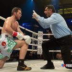 Luke Keeler taking a knee gathering his bearings during a knockdown. Photo Credit: www.proboxing-fans.com
