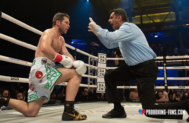 Luke Keeler taking a knee gathering his bearings during a knockdown. Photo Credit: www.proboxing-fans.com
