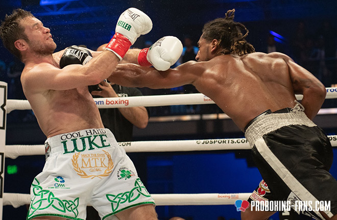 Luke Keeler taking a knee gathering his bearings during a knockdown. Photo Credit: www.proboxing-fans.com