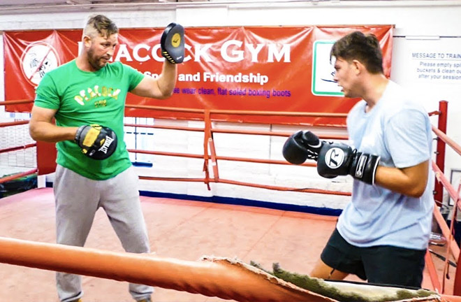 James Branch Jr working out on the pads with his father, James Branch Senior Credit: YouTube