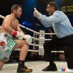 Luke Keeler taking a knee gathering his bearings during a knockdown. Photo Credit: www.proboxing-fans.com