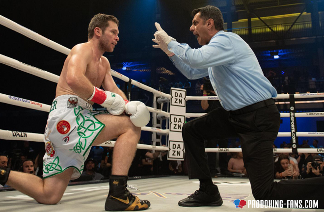 Luke Keeler taking a knee gathering his bearings during a knockdown. Photo Credit: www.proboxing-fans.com