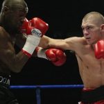 Gary Logan taking on Jamie Moore in his last professional bout. Photo credit: RTE