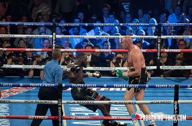 Tyson Fury dropping Deontay Wilder en route to a seventh round TKO victory. Photo Credit: Pro Boxing Fans