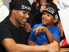 Shakur Stevenson signing autographs for a young fan who also received an official Team Stevenson headband. Photo Credit: Mikey Williams/Top Rank