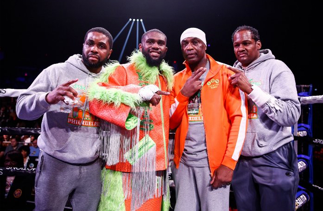 Ennis celebrates with his team after his 25th straight victory in Atlantic City Credit: Boxing Scene