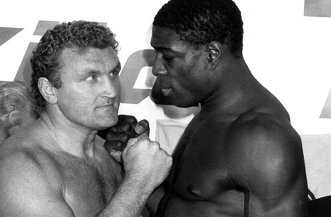 Joe Bugner and Frank Bruno face to face one last time before fight night. Photo Credit: That 1980's Sports Blog.