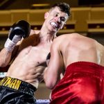 Nathan Heaney in action landing a left uppercut to the body. Photo Credit: Essentially Sports