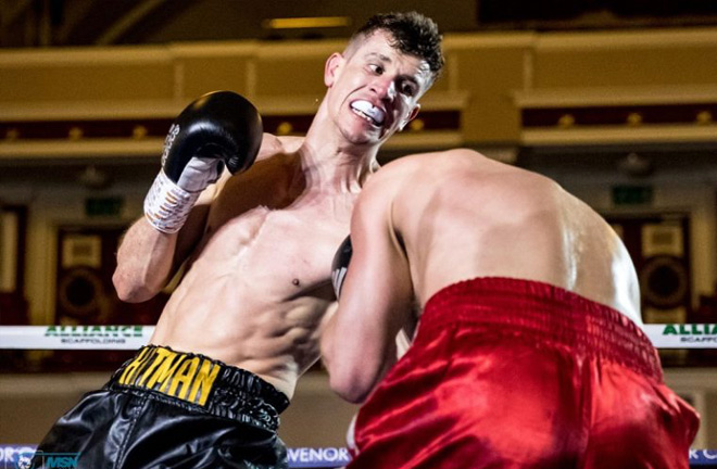 Nathan Heaney in action landing a left uppercut to the body. Photo Credit: Essentially Sports