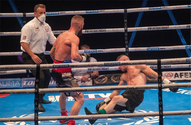 Lewis Crocker dropping Louis Greene en route to a stoppage victory. Photo Credit: Scott Rawsthorne/MTK Global