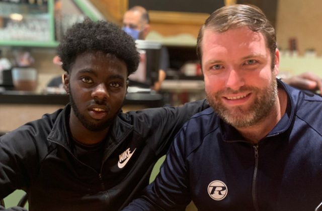 Adan Mohamed and his manager Alfie Warren. Photo Credit: Twitter / @alfieRwarren