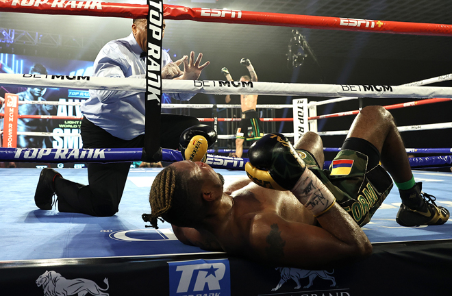 Alvarez was sent through the ropes after a combination from Smith to end the fight in the ninth Photo Credit: Mikey Williams/Top Rank