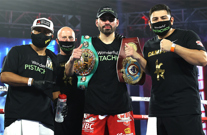 Ramirez celebrates with coach Robert Garcia and his team after victory Photo Credit: Mikey Williams/Top Rank