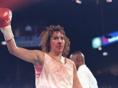 A bloodied and bruised Christy Martin, her defeats won't define her as she has fought her biggest fight outside of the ring. Photo Credit: Sportcasting.