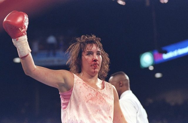 A bloodied and bruised Christy Martin, her defeats won't define her as she has fought her biggest fight outside of the ring. Photo Credit: Sportcasting.