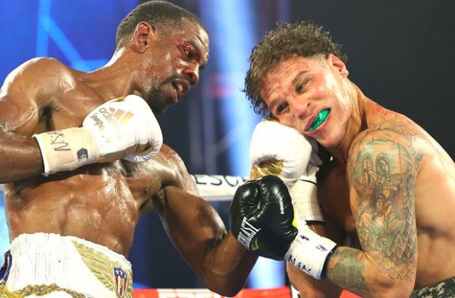 After repeated intentional head butts by Jonathan Oquendo, the winner by 8th-round DQ and still WBO Jr. Lightweight World Champion is Jamel Herring. Photo Credit: Top Rank.