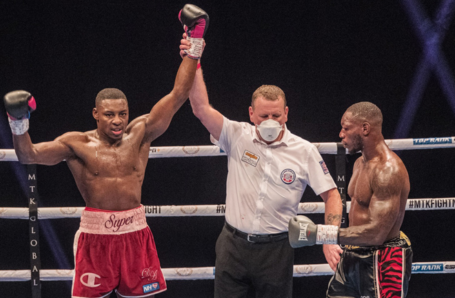 Azeez celebrates after beating Peacock Gym stablemate Sterling Photo Credit: Scott Rawsthorne / MTK Global