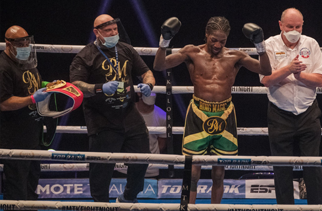 Ennis-Brown celebrates after securing a unanimous decision Photo Credit: Scott Rawsthorne /MTK Global