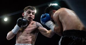 Andre Campos in action delivering a left hand uppercut to his opponent. Photo Credit: Antonio Avilab