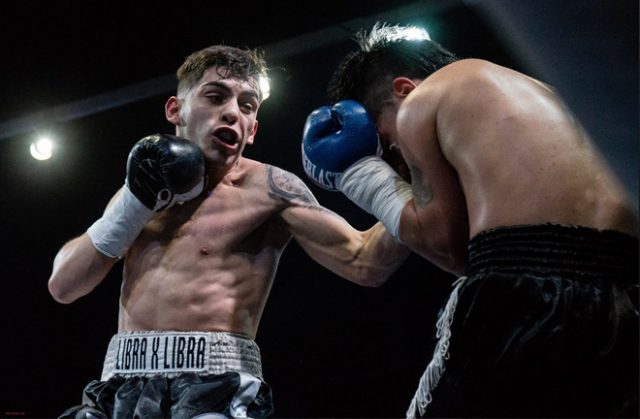 Andre Campos in action delivering a left hand uppercut to his opponent. Photo Credit: Antonio Avilab