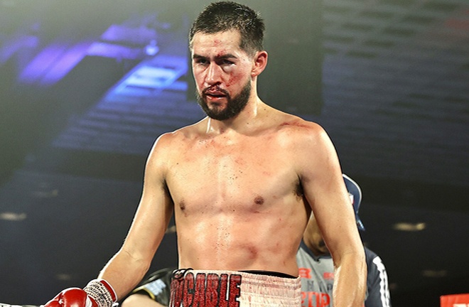 Molina was bloodied after a clash of heads with Pedraza Photo Credit: Mikey Williams / Top Rank 