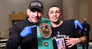 Lopez celebrates with father Teofimo Lopez Sr post-fight Photo Credit: Mikey Williams/Top Rank