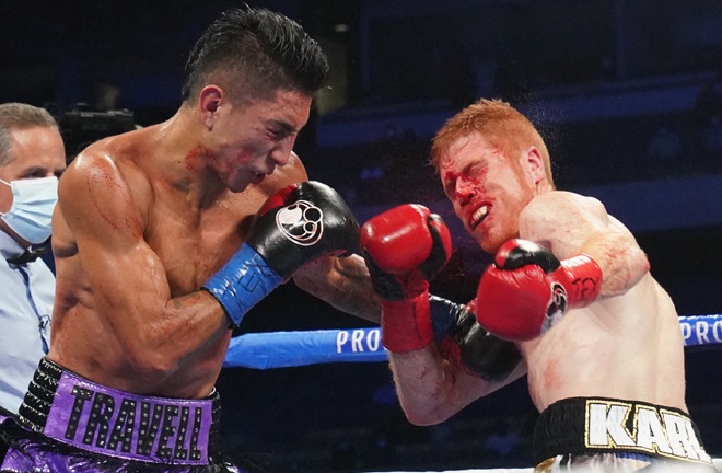 Mario Barrios knocked out the brave and bloodied Ryan Karl to retain his world title Photo Credit: Sean Michael Ham/Mayweather Promotions