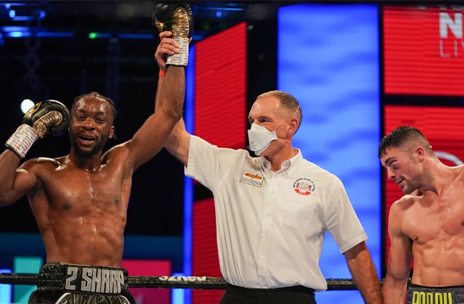 Bentley celebrates after winning the Lonsdale belt and winning his rematch with Heffron Photo Credit: Round 'N' Bout Media/Queensberry Promotions