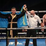 Tursynbay Kulakhmet celebrates after claiming beating a dejected Macaulay McGowan on Wednesday Photo Credit: Scott Rawsthorne/MTK Global