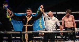 Tursynbay Kulakhmet celebrates after claiming beating a dejected Macaulay McGowan on Wednesday Photo Credit: Scott Rawsthorne/MTK Global