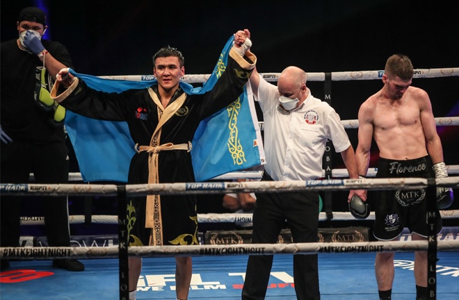 Tursynbay Kulakhmet celebrates after claiming beating a dejected Macaulay McGowan on Wednesday Photo Credit: Scott Rawsthorne/MTK Global