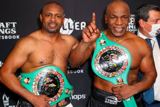 Mike Tyson vs Roy Jones Jr ended in a draw. Both men posed after the bout with their belts following their split draw decision. CREDIT: USA TODAY SPORTS