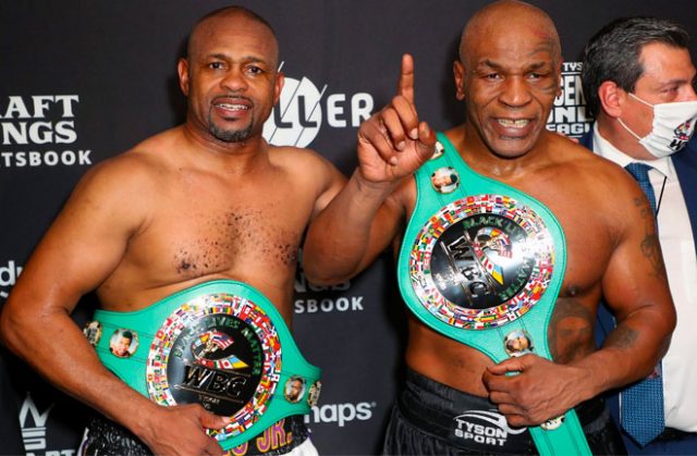 Mike Tyson vs Roy Jones Jr ended in a draw. Both men posed after the bout with their belts following their split draw decision. CREDIT: USA TODAY SPORTS