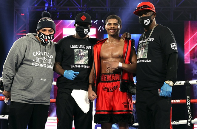 Stevenson celebrates with his team after closing out Top Rank's 2020 schedule Photo Credit: Mikey Williams/Top Rank via Getty Images