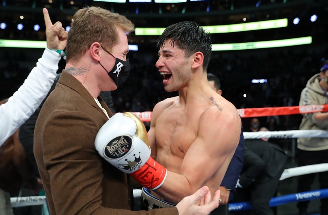 Canelo Alvarez celebrates with stablemate Garcia after his victory Photo Credit: Tom Hogan-Hogan Photos/Golden Boy