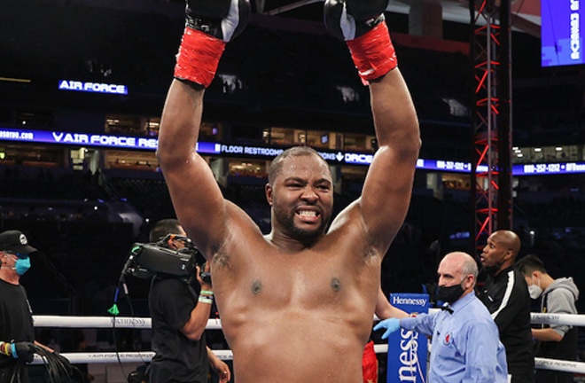 Forrest celebrates after fighting back to earn a draw Photo Credit: Ed Mulholland/Matchroom