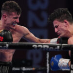 Nathan Heaney knocked down Ryan Oliver on route to a points win Photo Credit: Round ‘N’ Bout Media/Queensberry Promotions