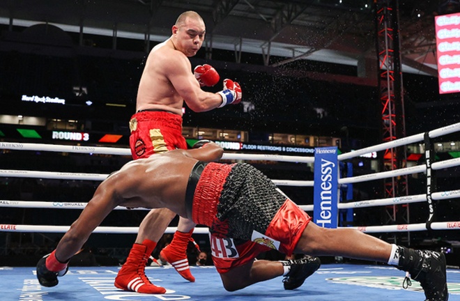 Zhang knocked down Forrest in each of the opening three rounds Photo Credit: Ed Mulholland/Matchroom