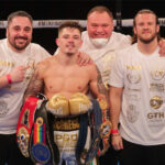 Lee McGregor celebrates with his team including trainer Ben Davison after winning the European Bantamweight title on Friday Photo Credit: Scott Rawsthorne/MTK Global